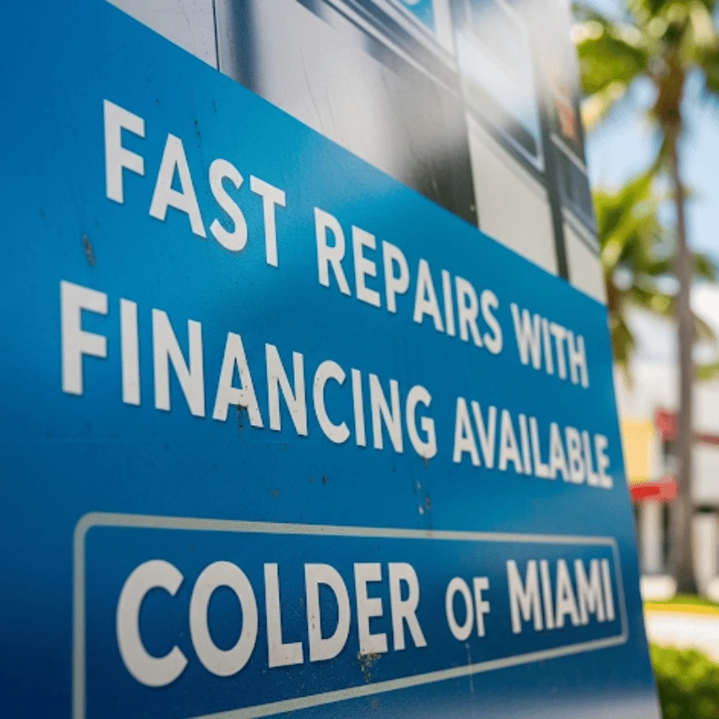 Sign promoting fast HVAC repairs with financing available by Colder of Miami. Flexible payment options for commercial and residential customers in South Florida.