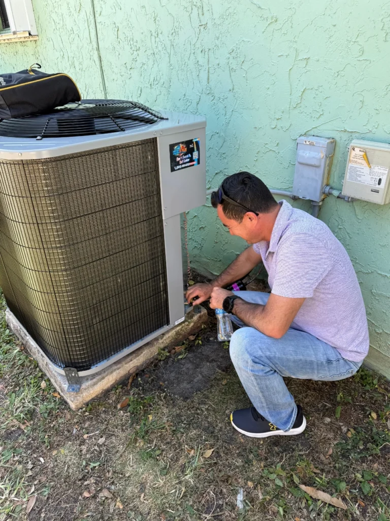 Colder of Miami technician diagnosing an AC unit in Miami, FL