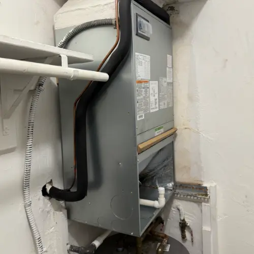 A GrandAire outdoor AC condenser unit requiring repair services to combat high heat in Hollywood, Florida.